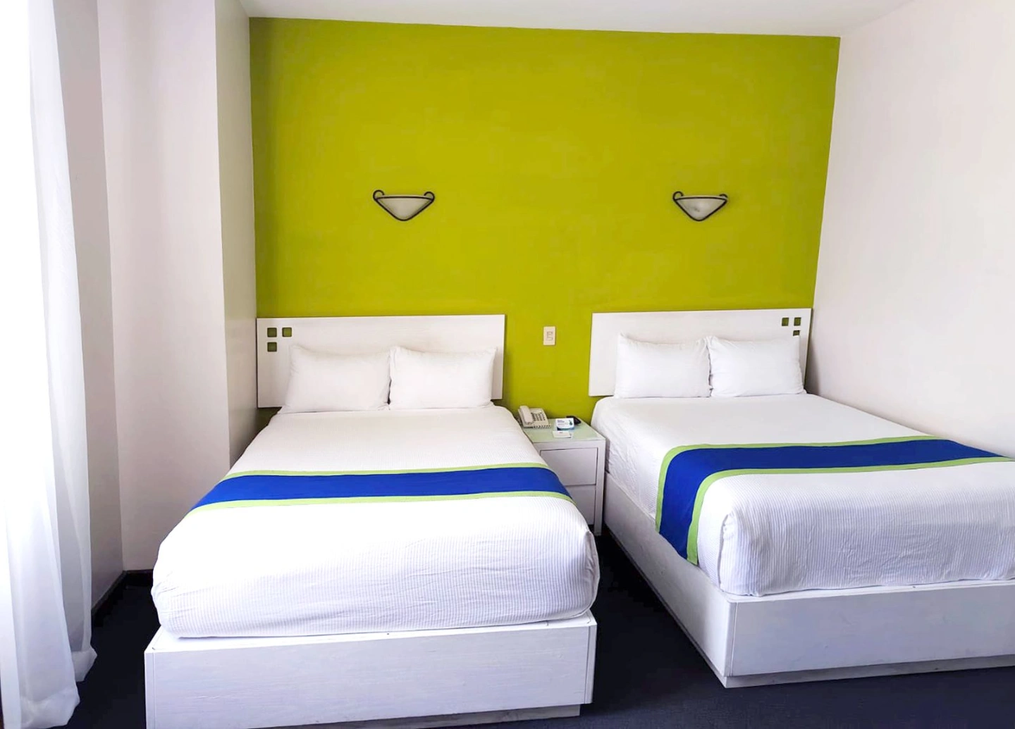 Standard room with three double beds